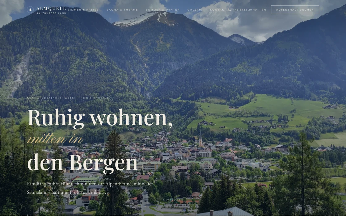 A cinematic spa hotel website concept in deep petrol over an Alpine valley
